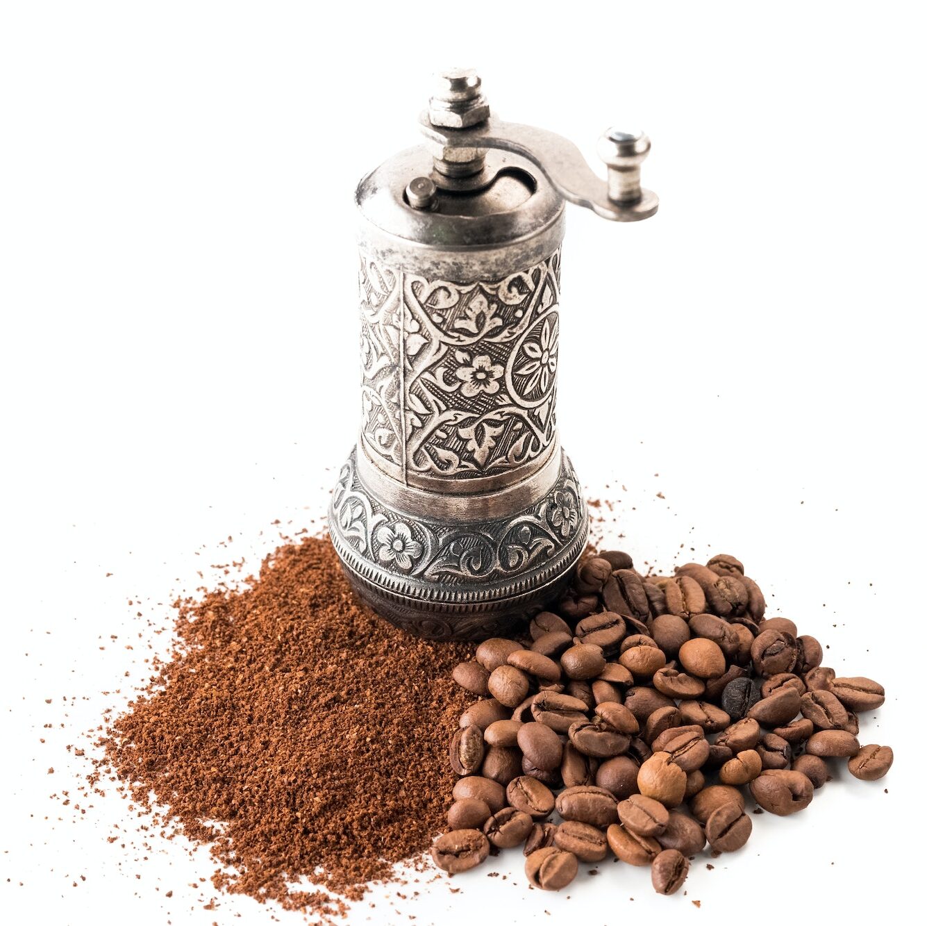 Coffee and grinder on white background